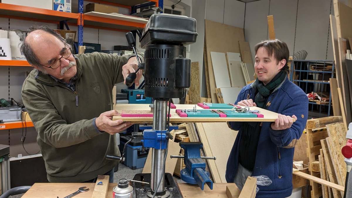 Photo from the workshop: Seppi and bastelbot drilling things with the drill press
